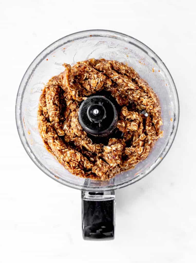 The applesauce, dates and oatmeal combined in a food processor.