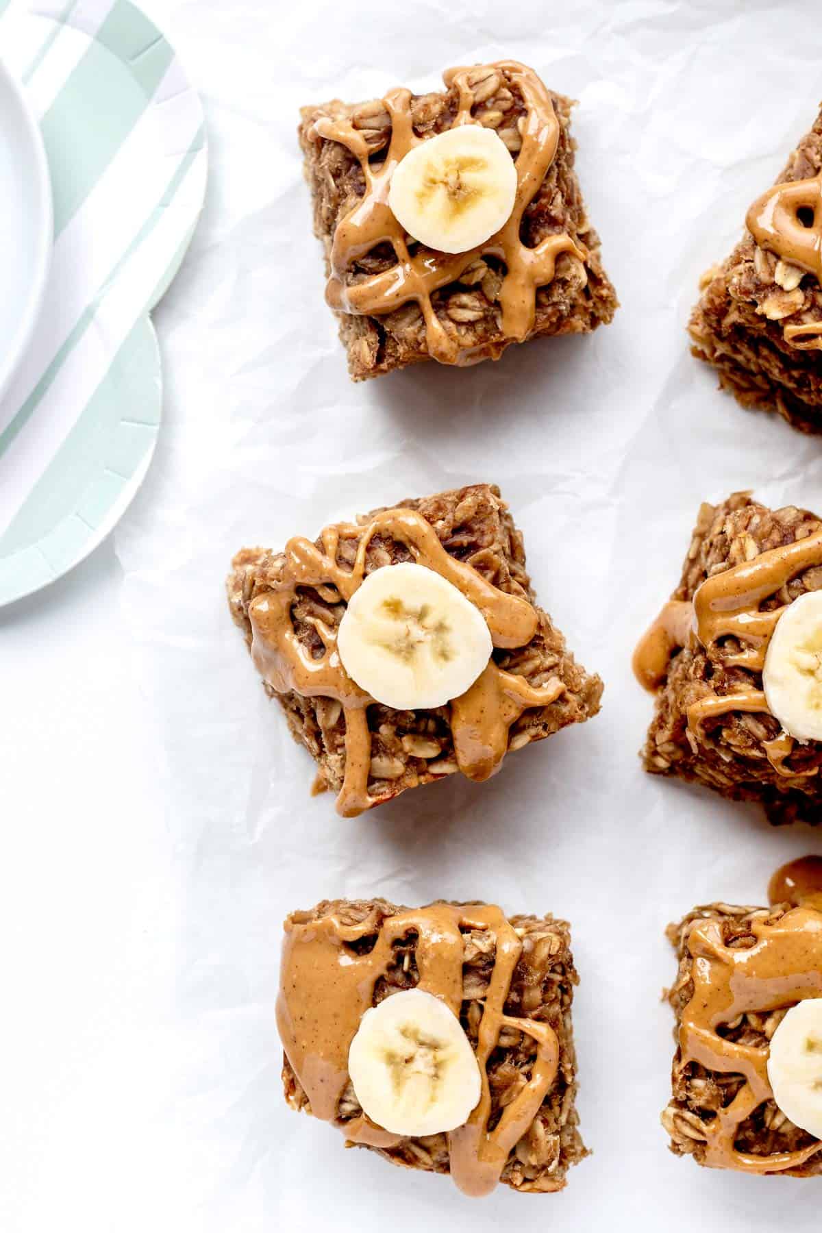 Baked oatmeal bars with banana slices and peanut butter.
