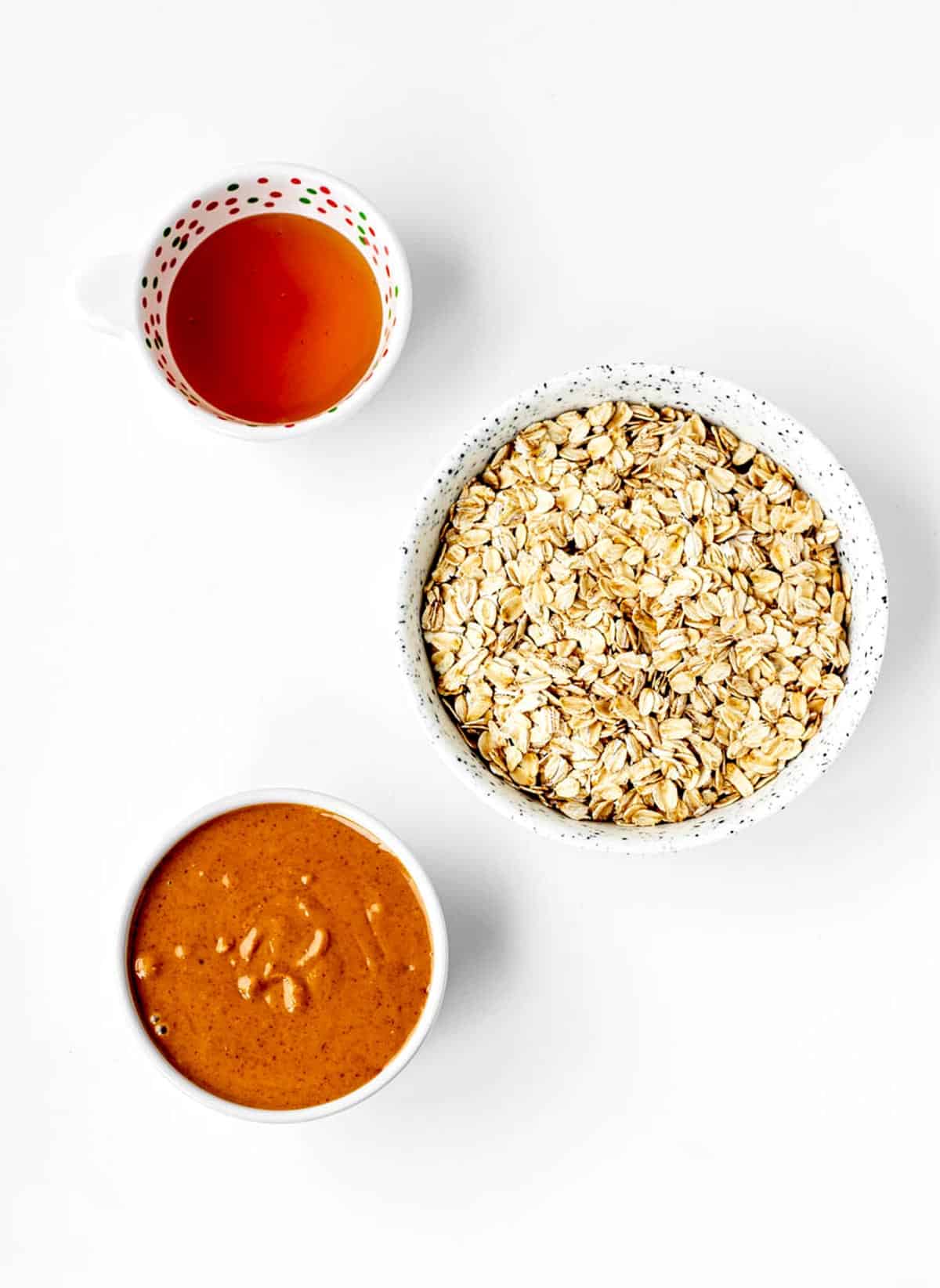 Oats, peanut butter, and maple syrup for the 3-ingredient peanut butter oatmeal balls recipe.