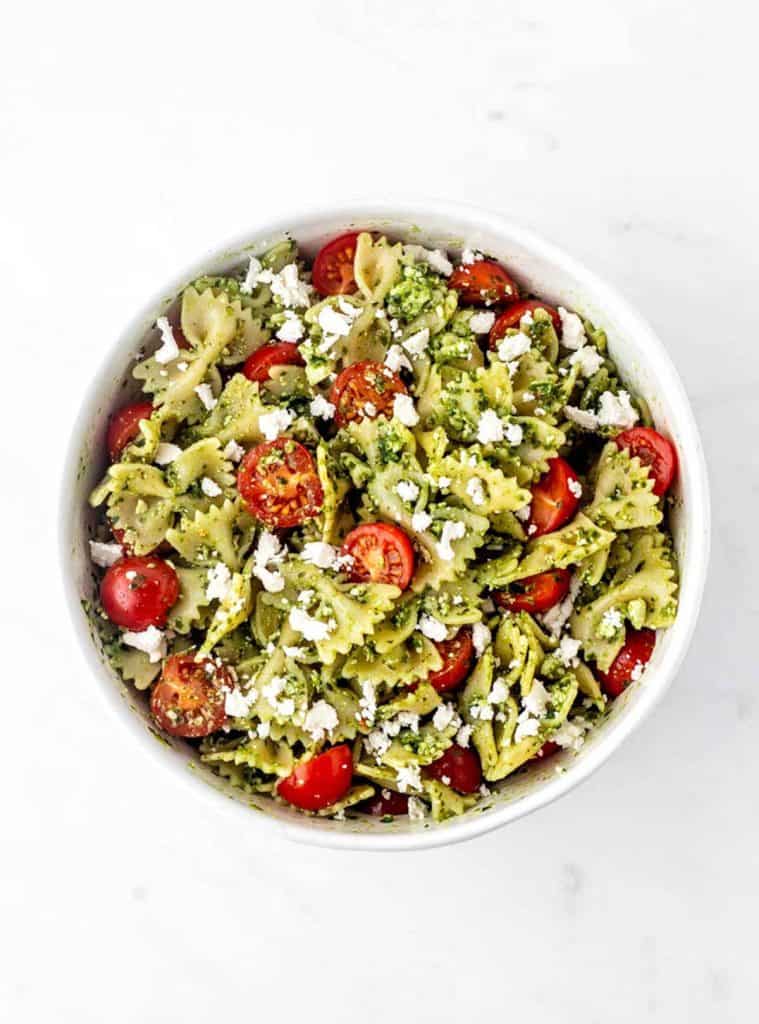 The 4 ingredient pasta salad recipe mixed together in a white bowl.