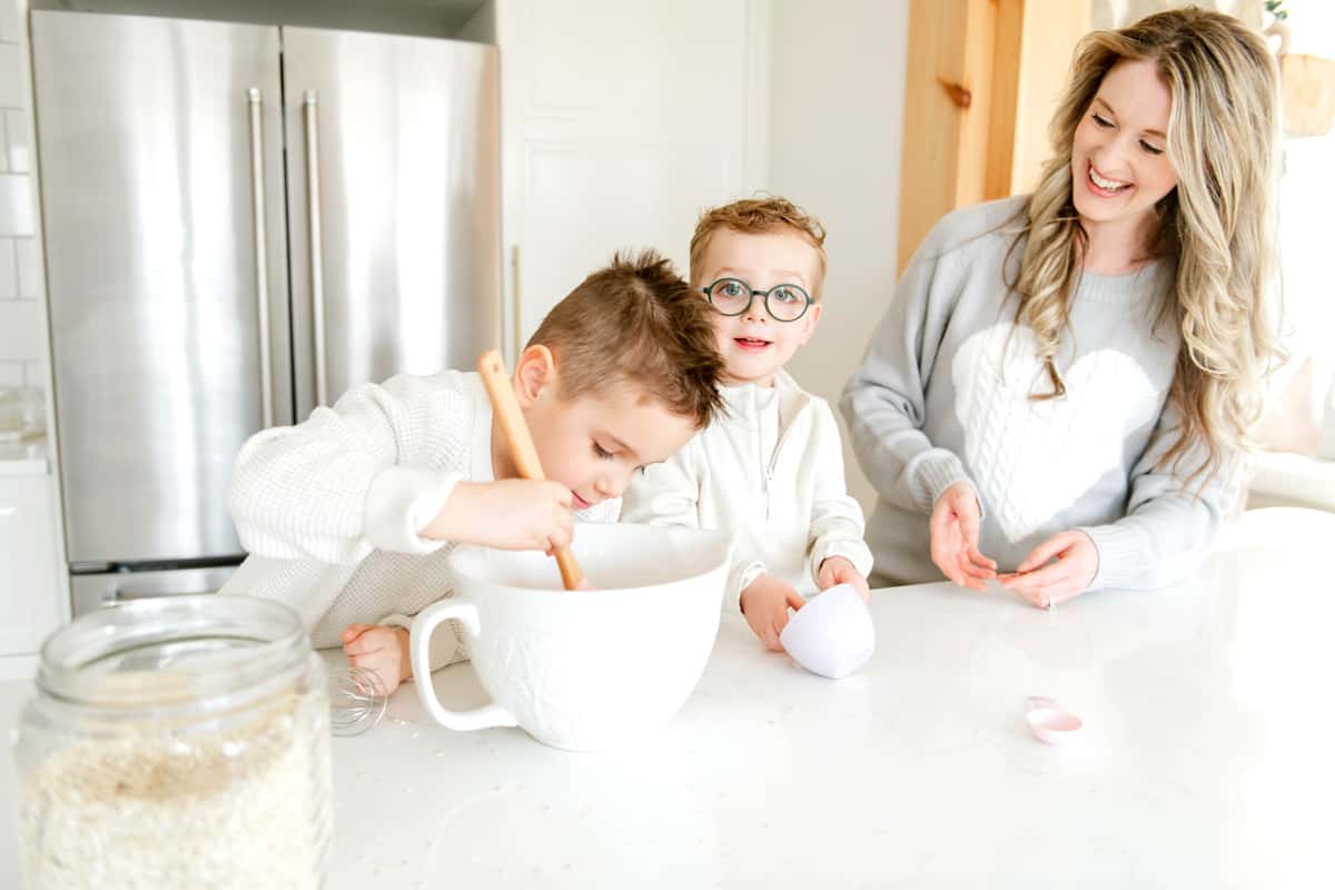 Elysia and kids making a recipe in the kitchen.