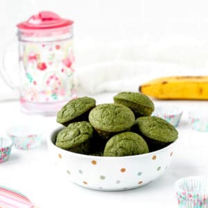 A bowl of mini green monster muffins.