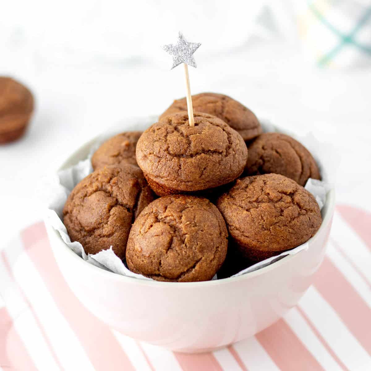 Mini date muffins in a pink bowl with a star topper.
