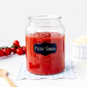 Low sodium pizza sauce in a jar with a chalkboard label with the words "pizza sauce."