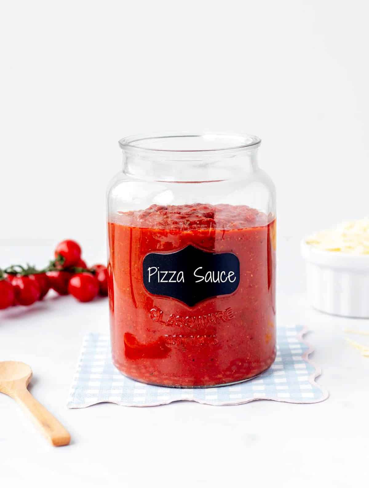 Low sodium pizza sauce in a large jar with a label that says "pizza sauce."