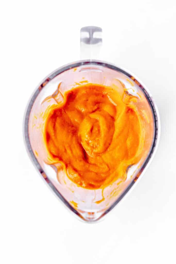 The roasted carrot pasta sauce in a blender.