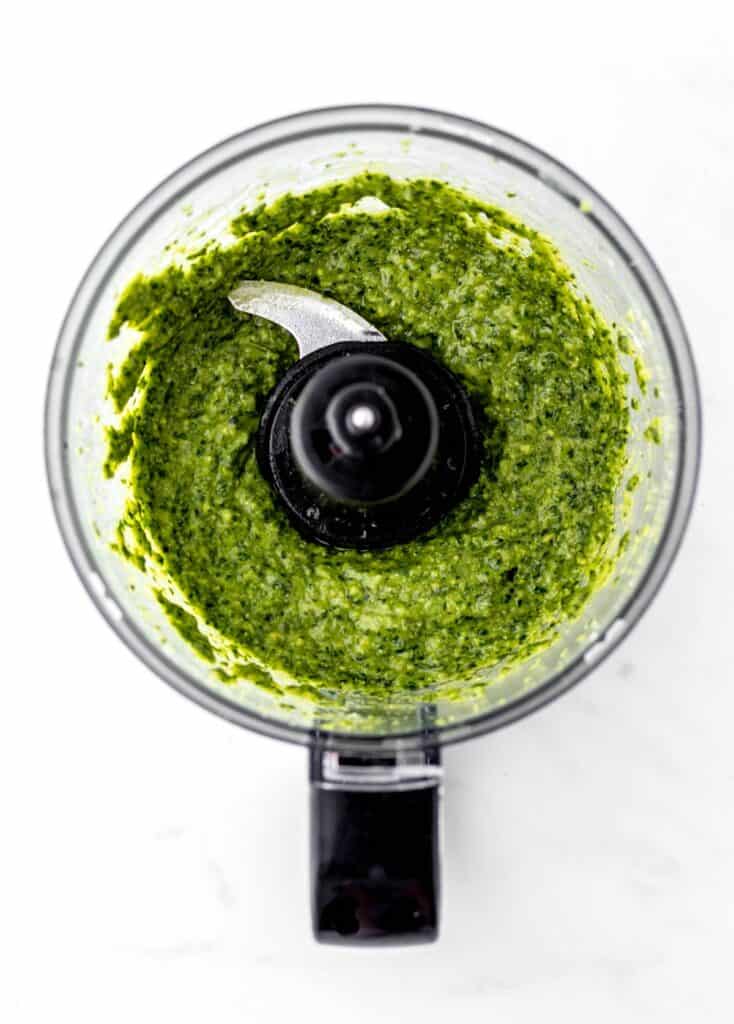 Green pasta sauce mixed in a food processor.