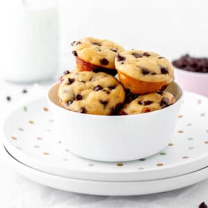 A bowl filled with mini chocolate chip muffins without milk.