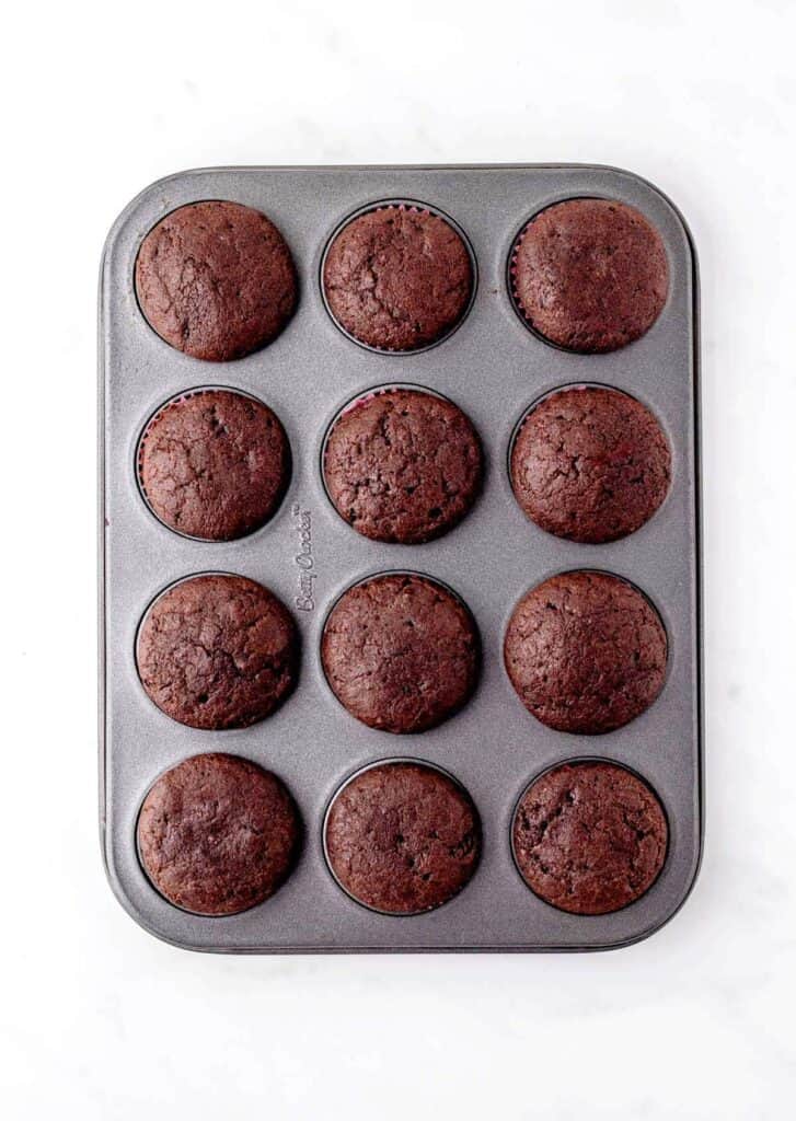 The baked mini chocolate cupcakes in a mini muffin tin.