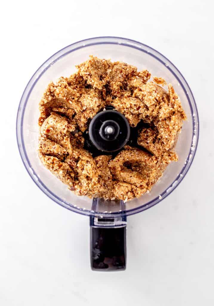 Cashews, oats, coconut and dates blended in a food processor.