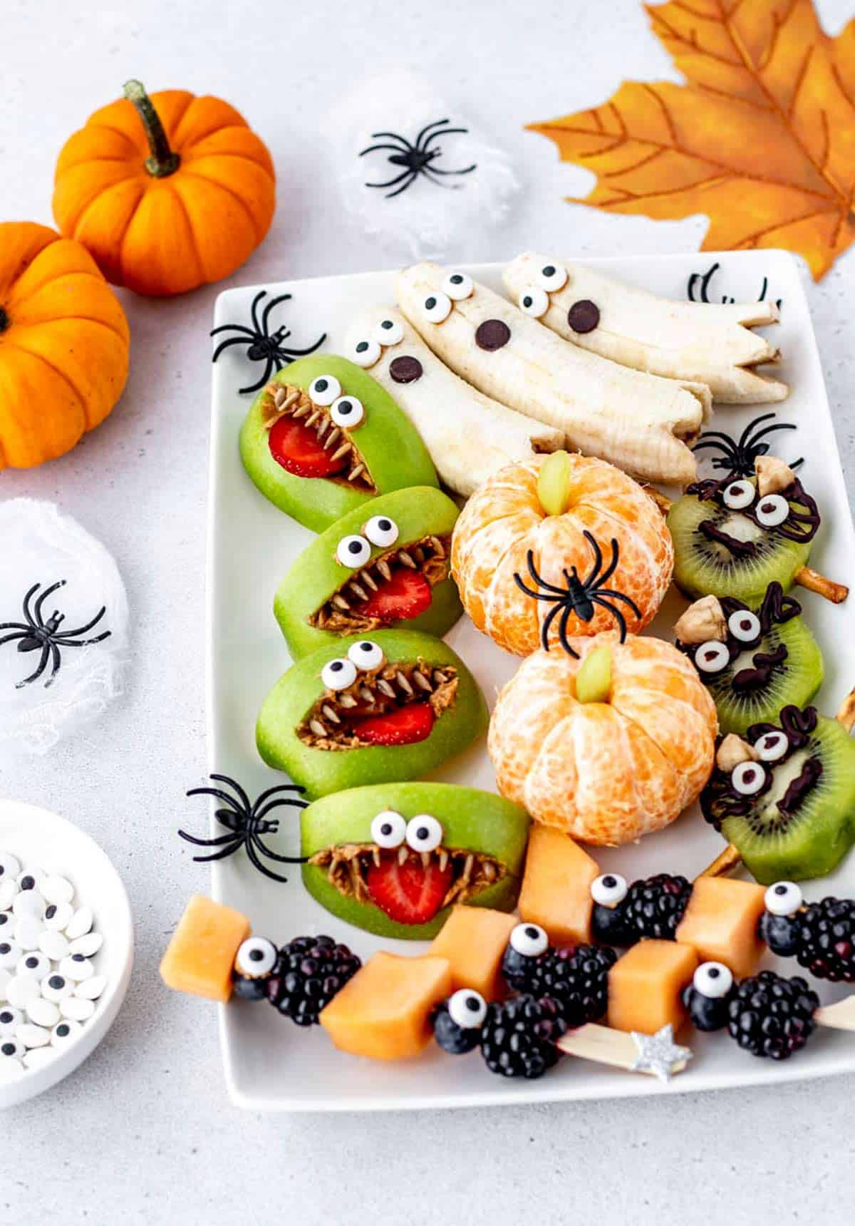 Halloween fruit platter with four different Halloween fruit snacks.