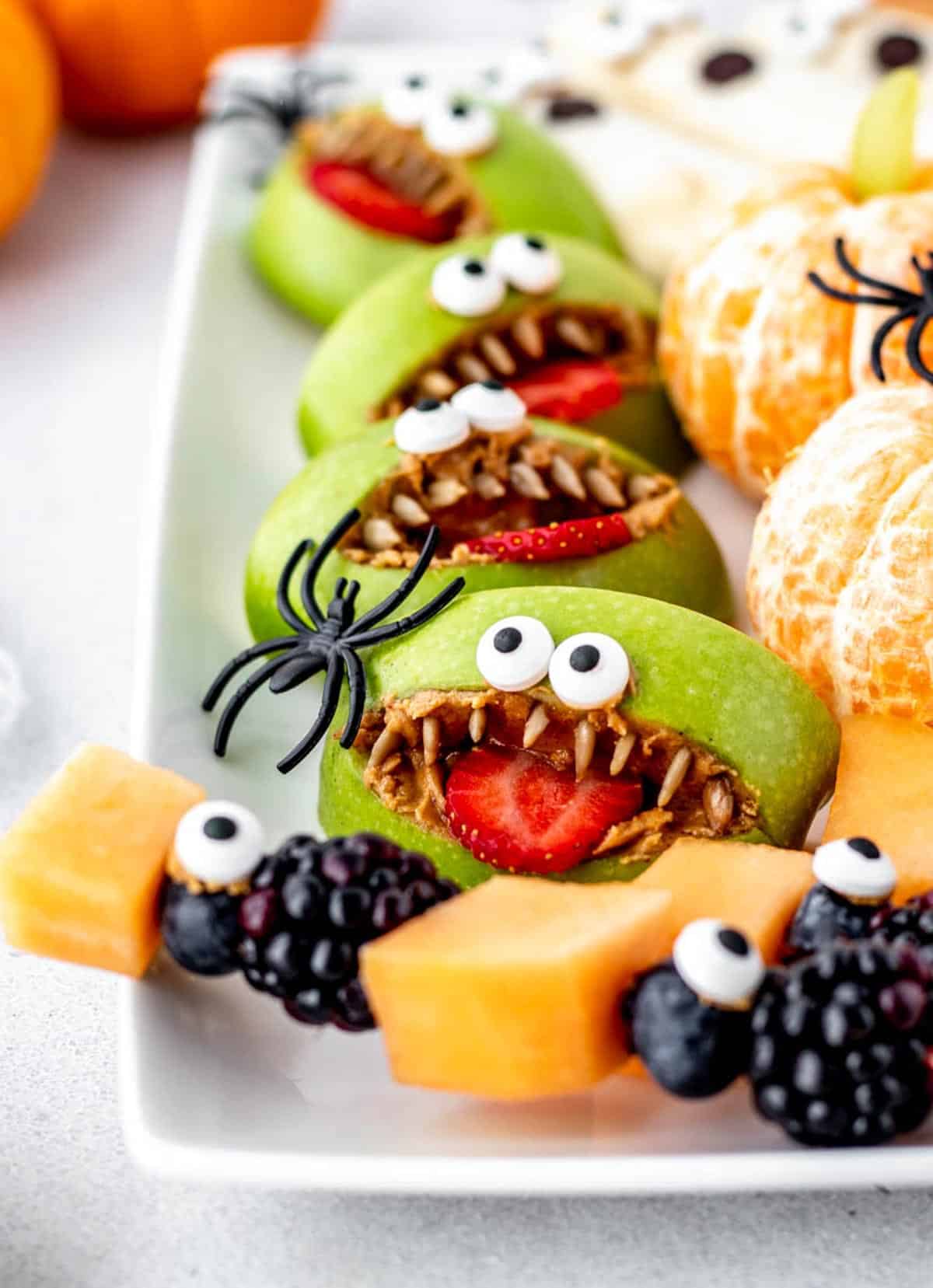 Close up image different Halloween fruit tray ideas.