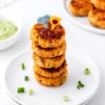 Close up image of mini salmon cakes with leftover salmon topped with two cute little picks.