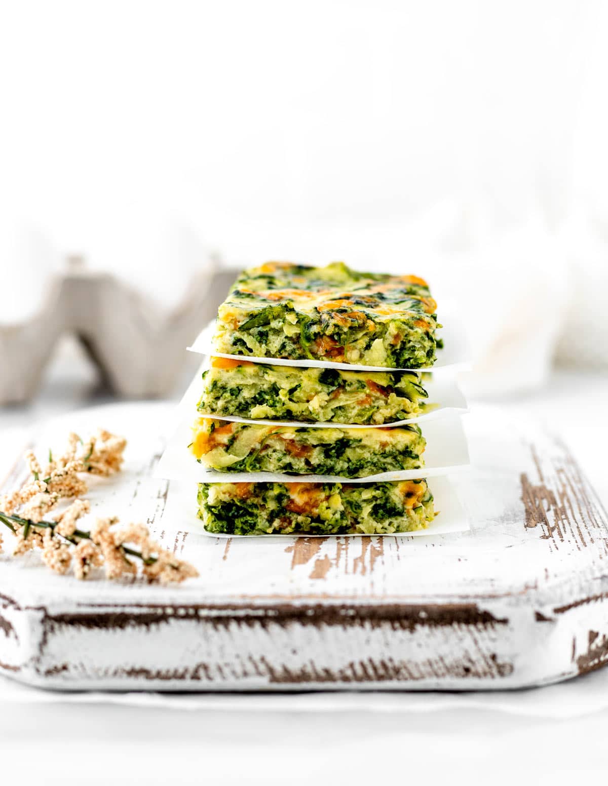 Four slices of the veggie frittata fingers stacked.