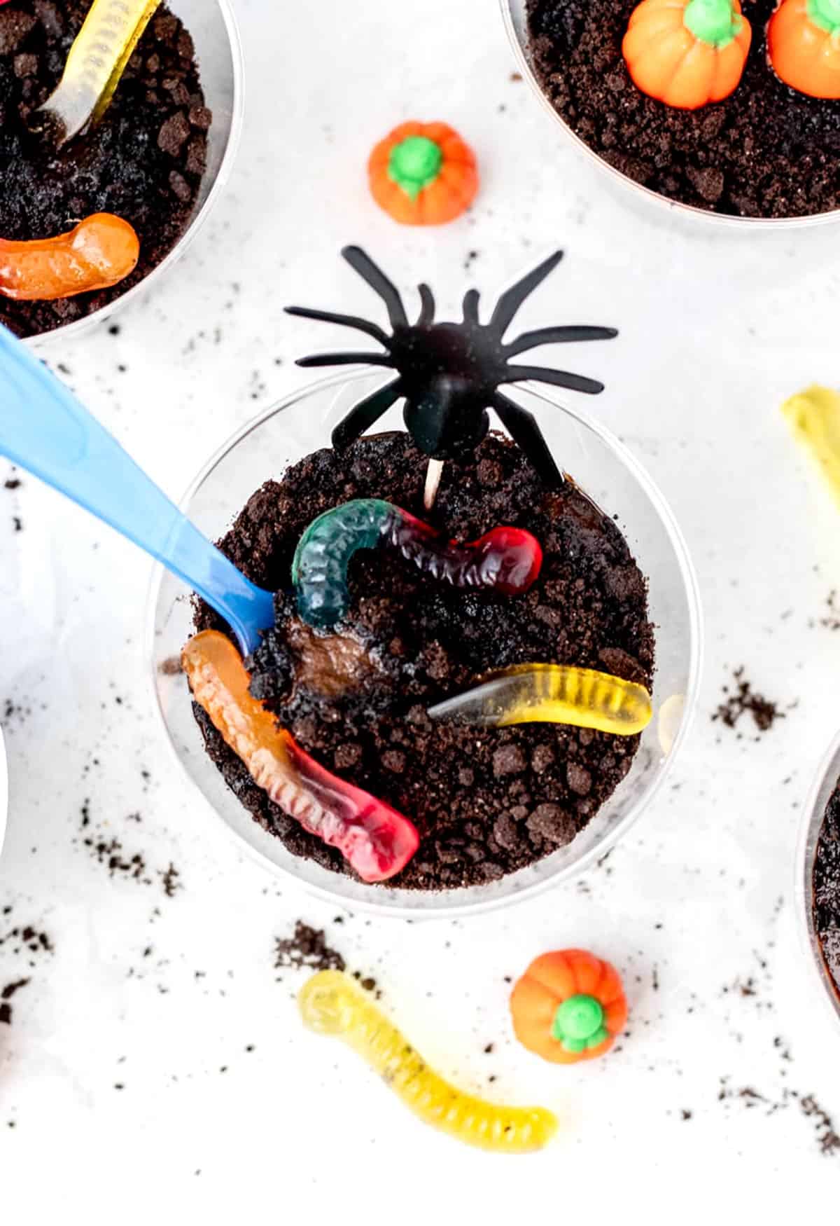 A spoon digging into a healthy Halloween dirt cup.