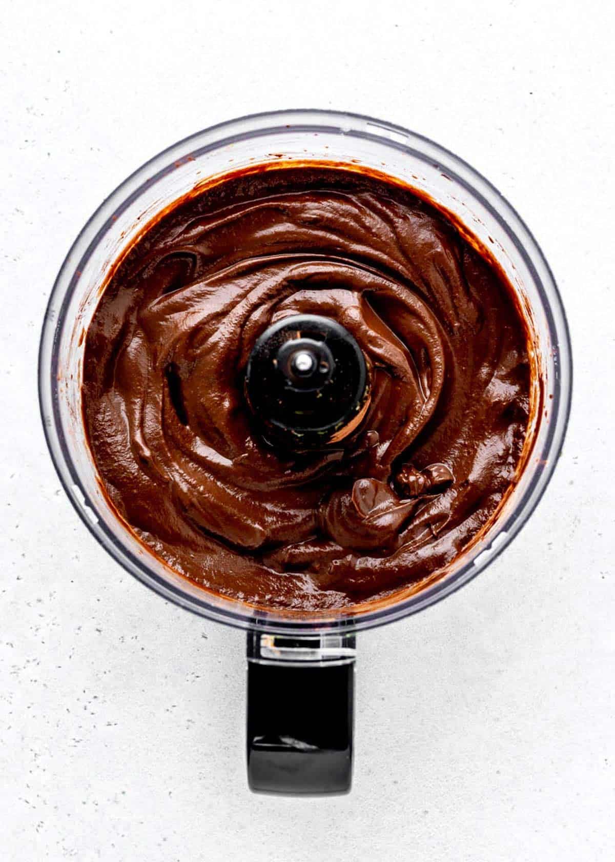Chocolate avocado pudding blended in a food processor.