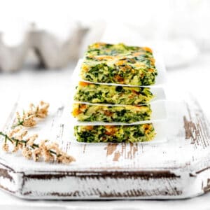 Baby frittata recipe sliced and stacked on top of each other.