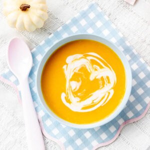 Pumpkin soup for baby with a heart made with coconut milk.